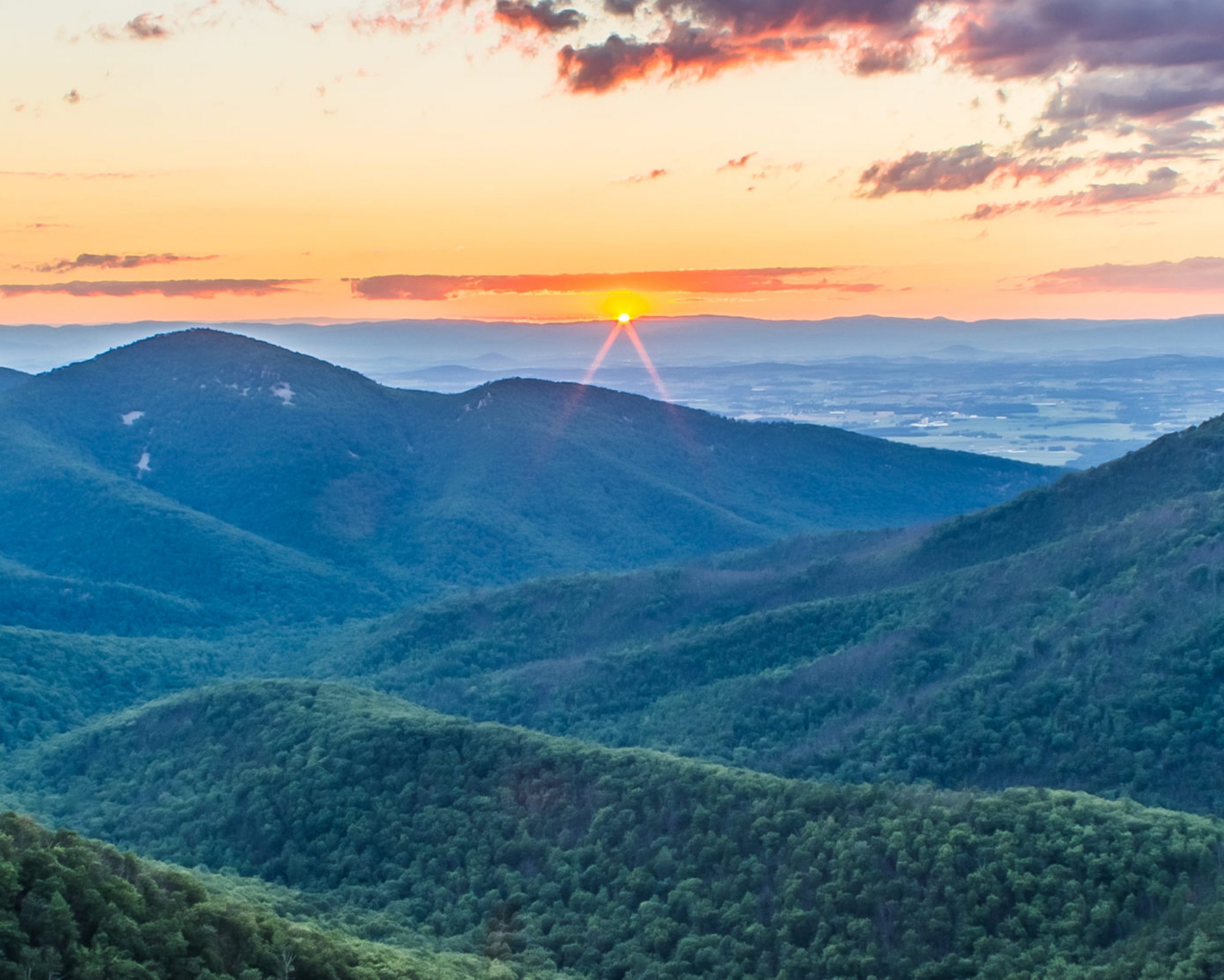 A sunset with clouds as seen from Skyline Drive of Shenandoah National